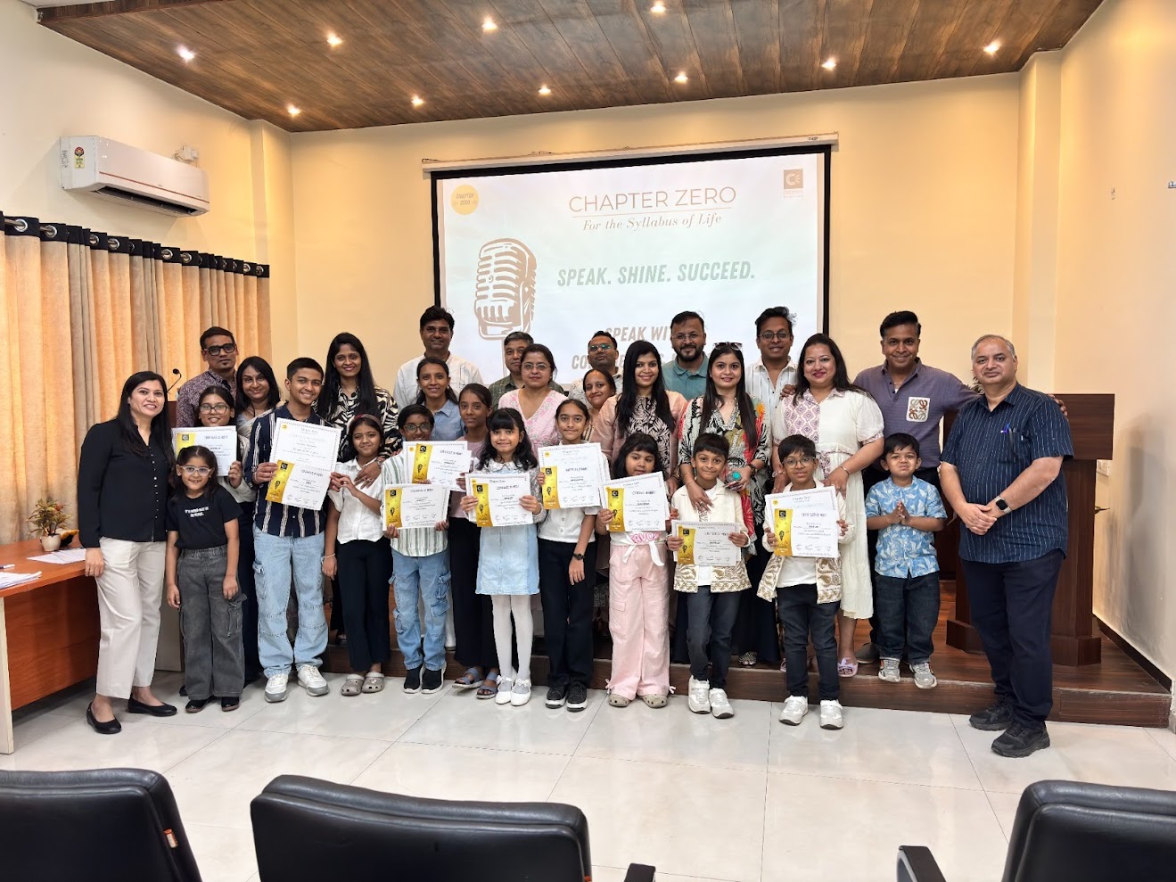 Chapter Zero students celebrating their certificates with families and mentors